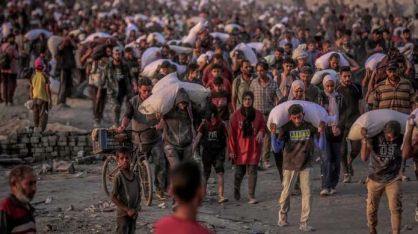 În Gaza, au tras cu tunurile de pe tancuri în populația civilă înfometată, care aștepta camioanele cu mâncare 